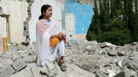 Melting glaciers leave homes teetering in valley of jagged m